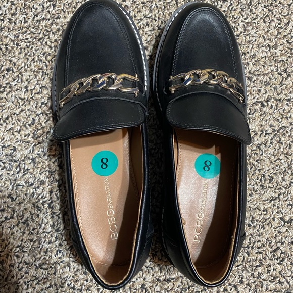 BCBG Shoes - BCBG black loafers w gold accent